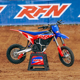 Rider on an RFN Warrior SX-E8 electric dirt bike on a motocross track